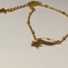 Noa: Bracelet doré avec un médaillon blanc et une étoile – Image 9