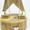 Eva: Collier sautoir argenté en acier chirurgical avec un trèfle à 4 feuilles – Image 3