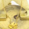 Victoria : Collier sautoir doré en acier chirurgical avec un pendentif ange.